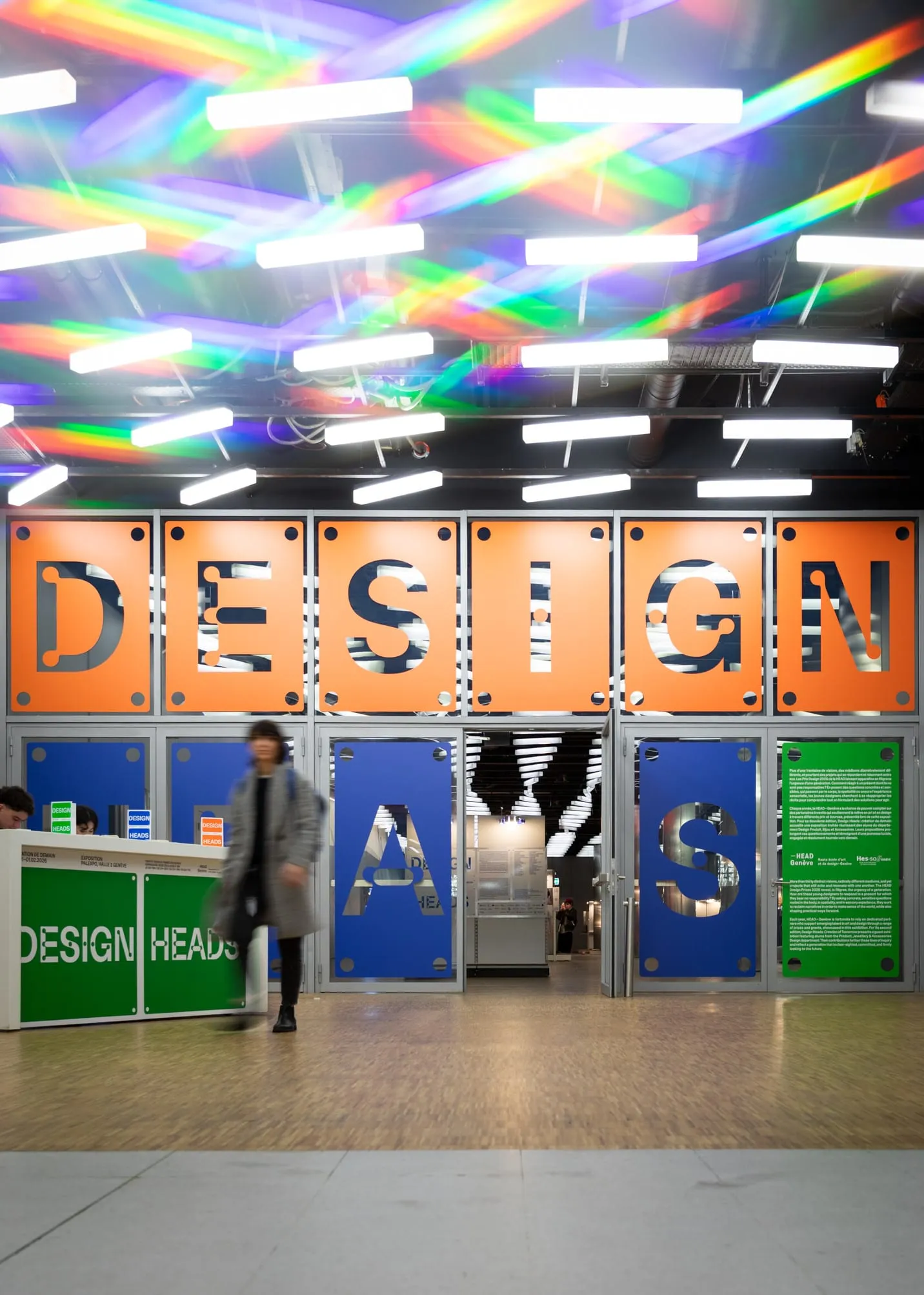 Large orange, blue and green panels with DESIGN HEADS lettering, Design Heads 2026.