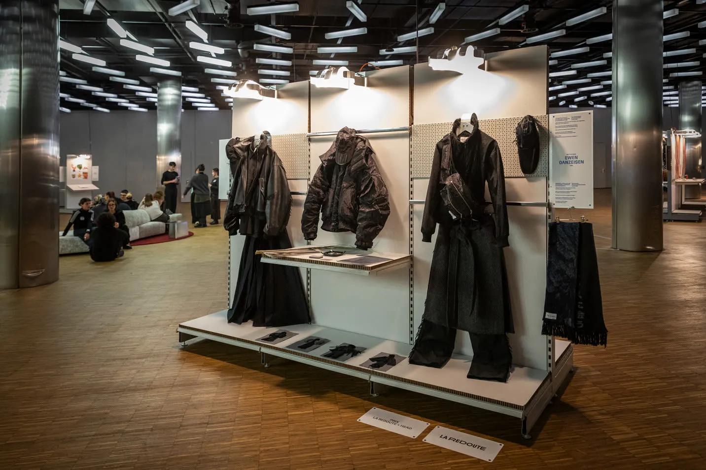 Jackets displayed on the shelves of a module.