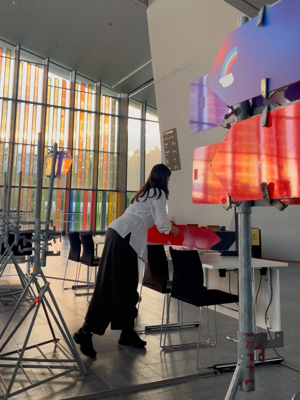 Karen Pisoni installing the Showcase E4S signage, made from reused road signs.