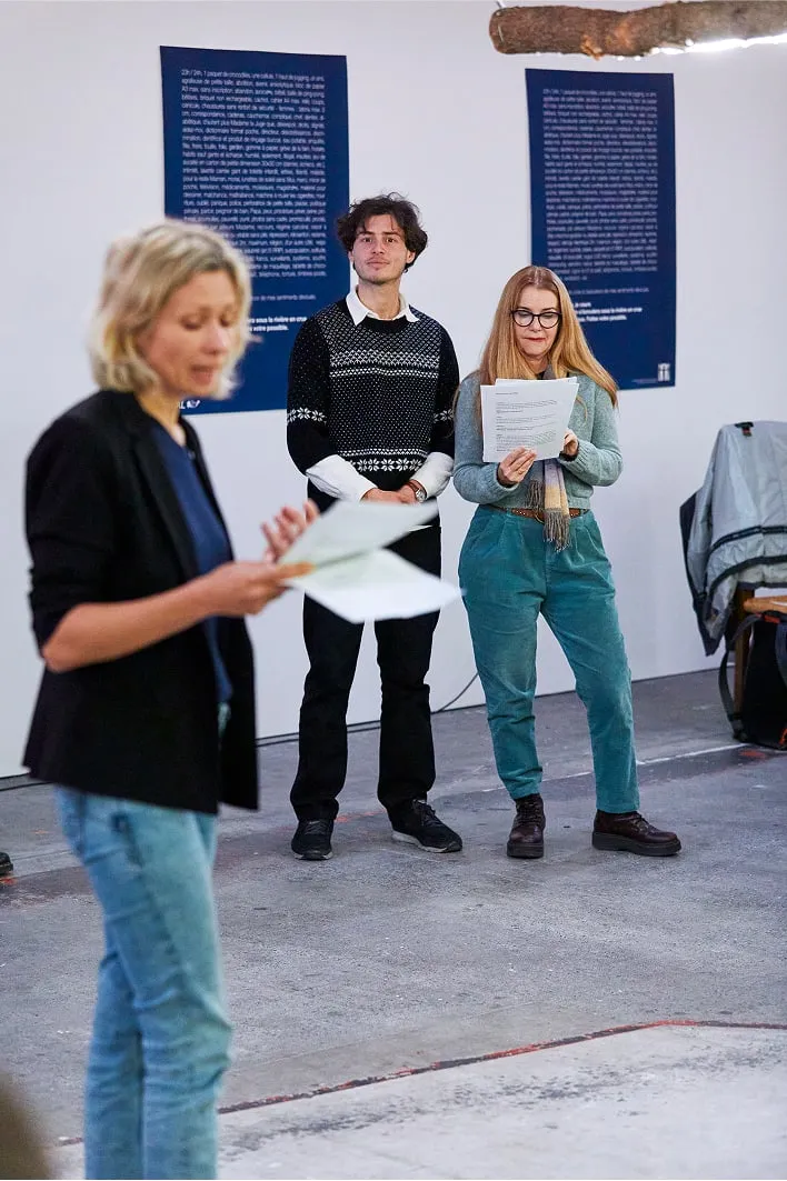 A group of people standing around a white frisbee
