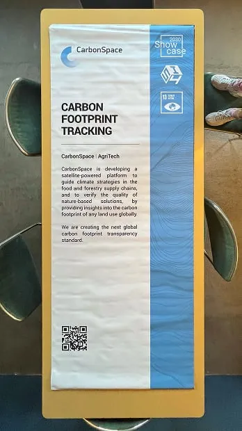 A close up of a sign near a bench