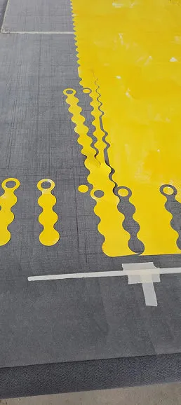A parking lot with yellow and black markings