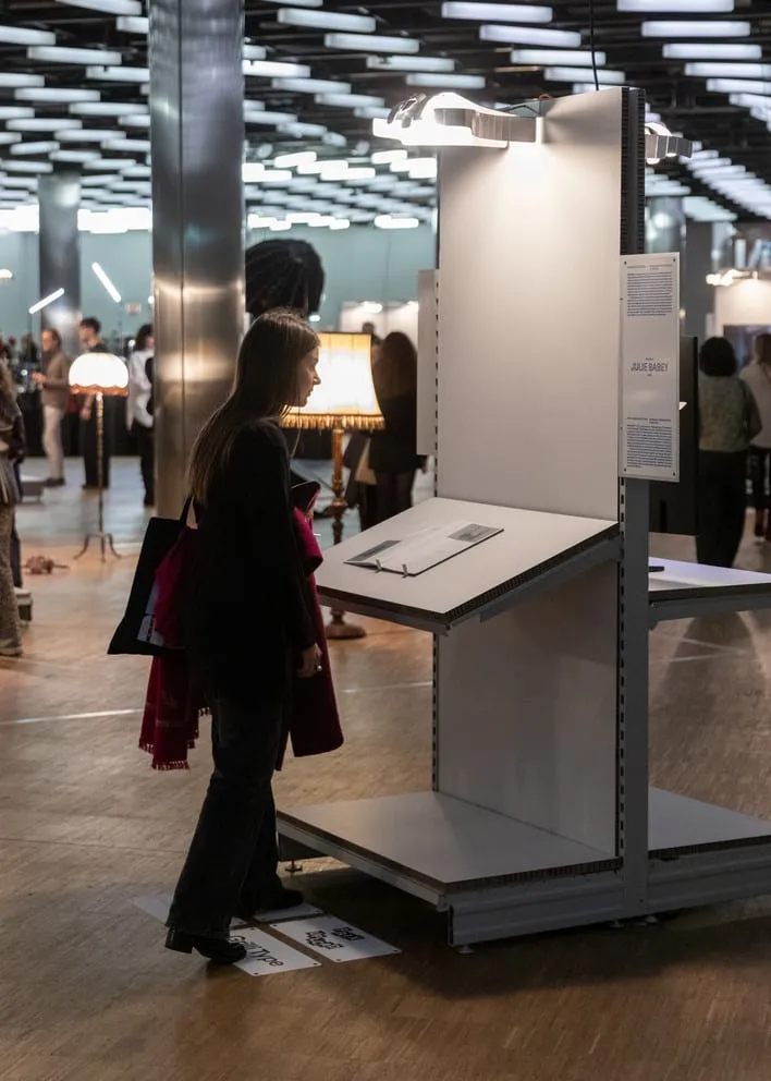 A visitor reading the information on a lectern module.
